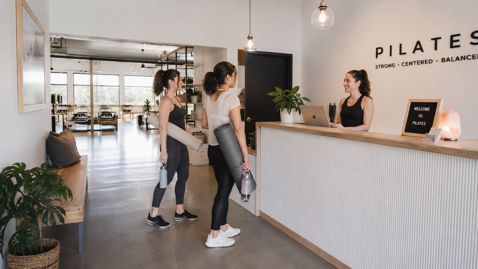 A member checking in at a studio reception